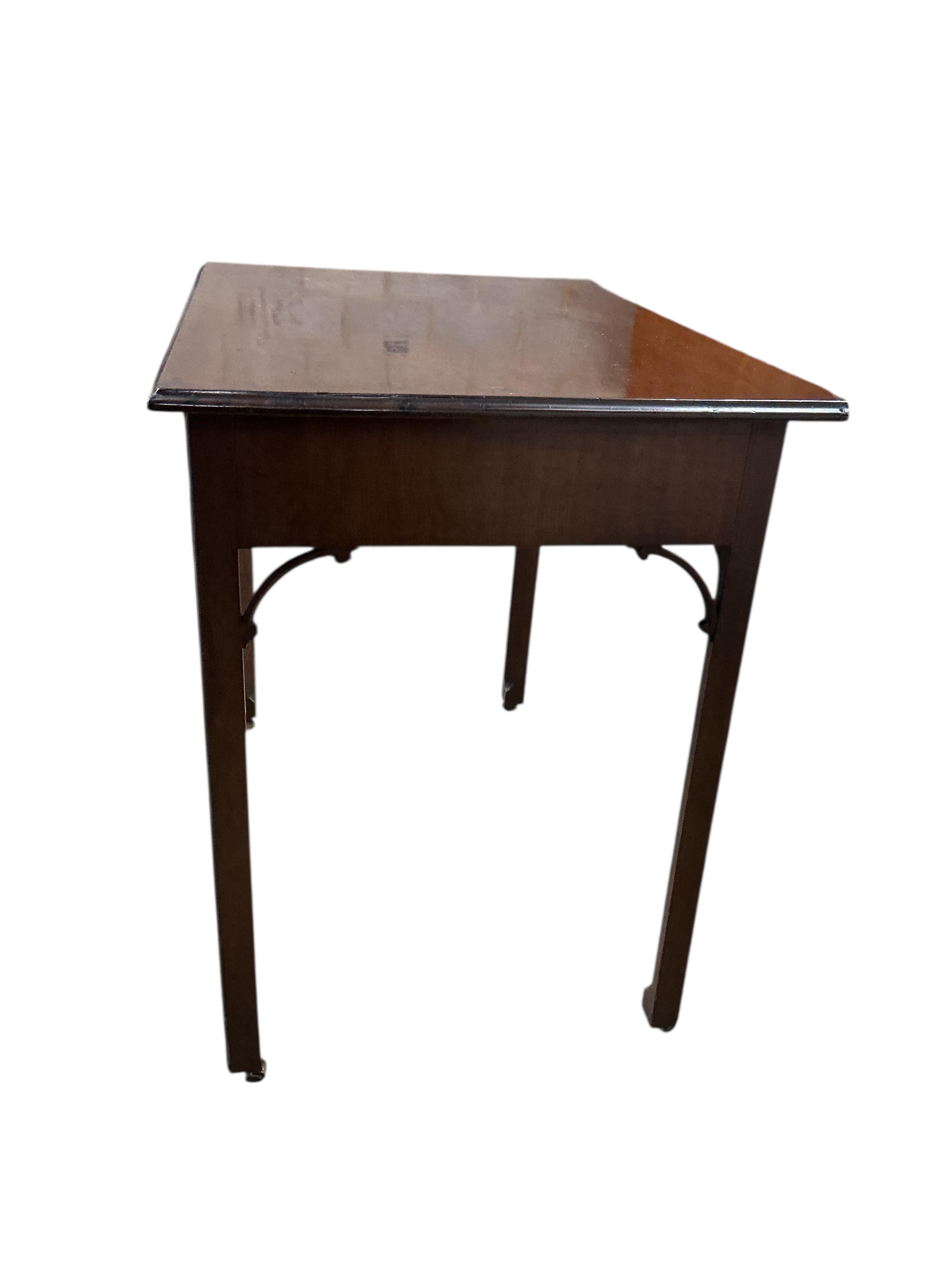 A George III mahogany serving table on chamfered square legs, width 91cm, depth 61cm, height 79cm.